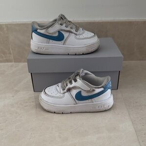 Kids Nike Air Force 1 Sneakers with Blue Swoosh